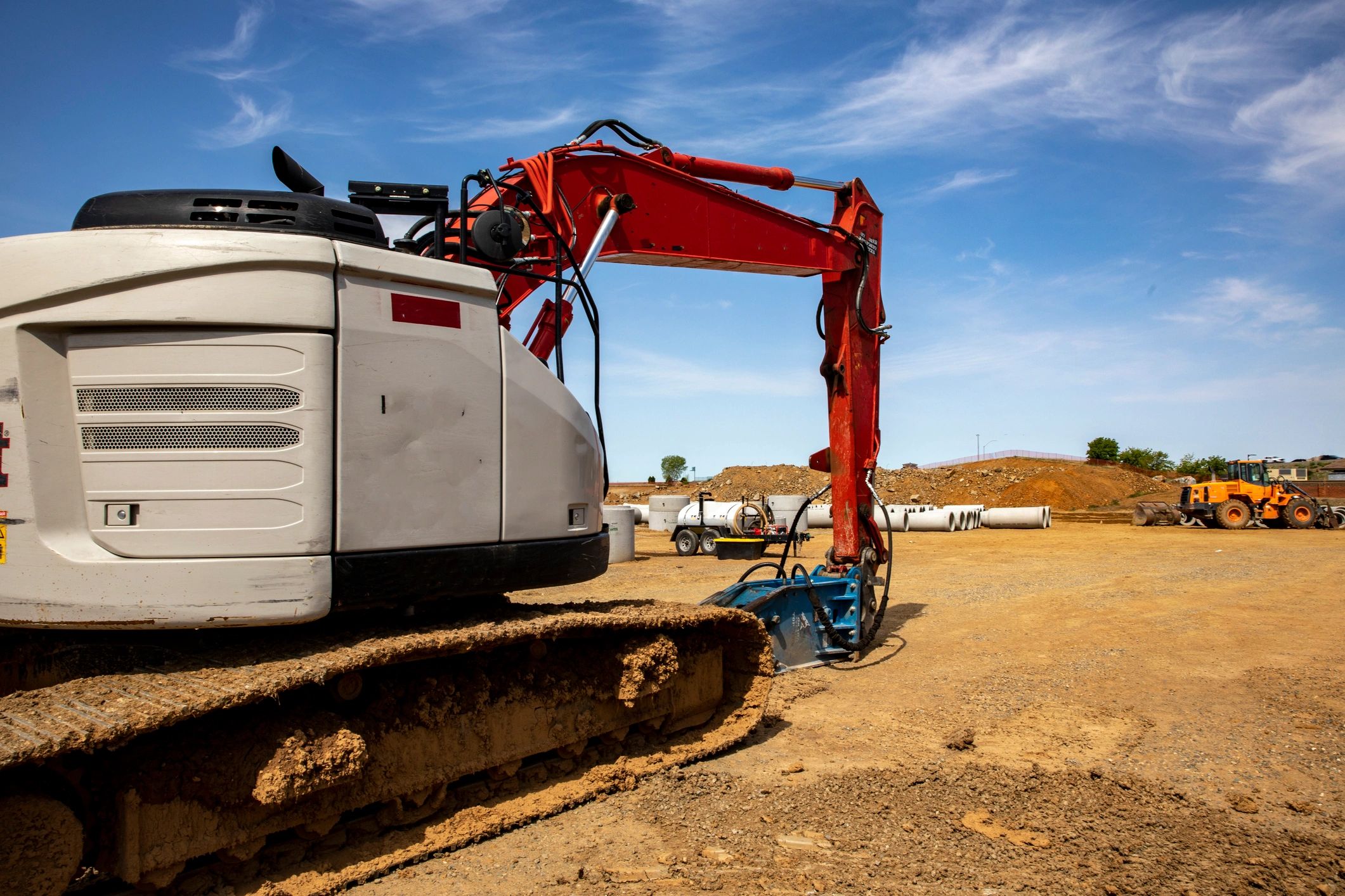 Construction equipment on site for trenching and excavation work